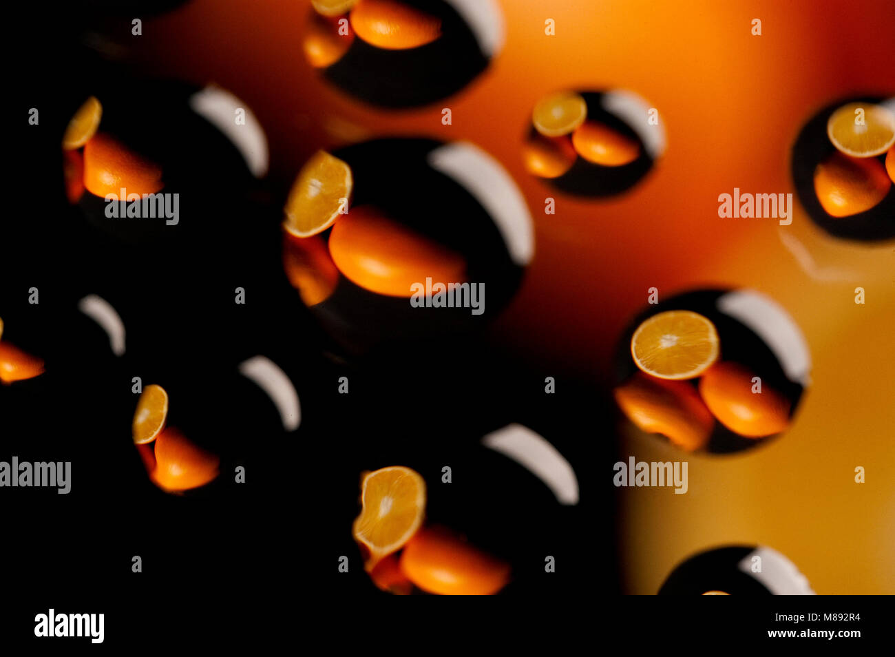Oranges reflected in drops of water, juice Stock Photo