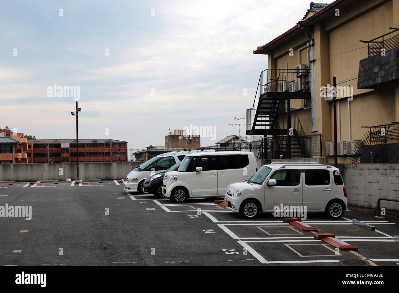 Undefined car parking at the outdoor public carpark in Kyoto, Japan Stock Photo