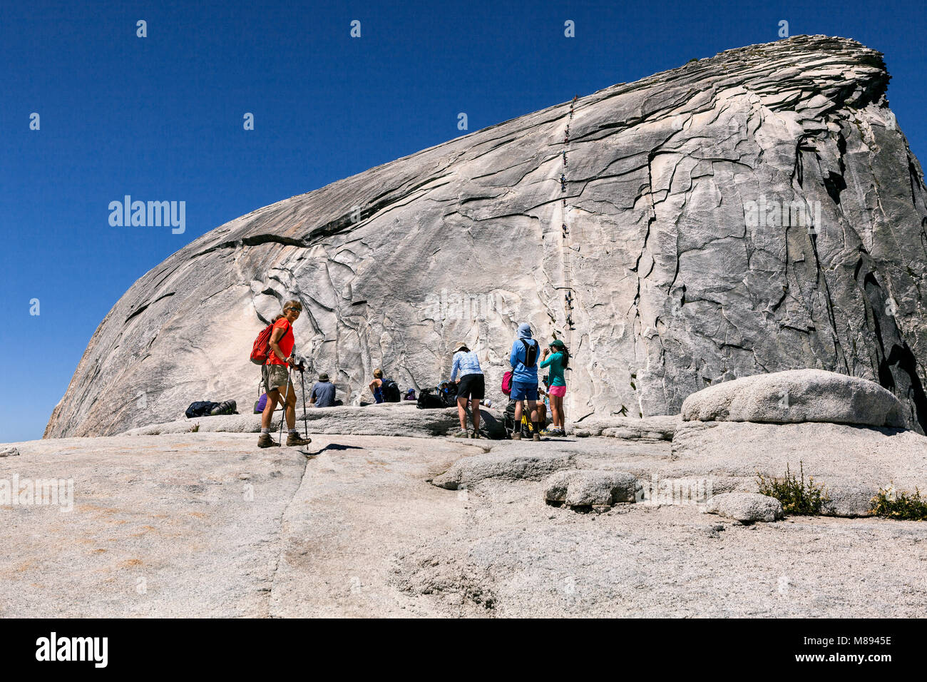 CA02878-00...CALIFORNIA - Hikers aproaching the cable route up Half  Dome in Yosemite National Park. Stock Photo