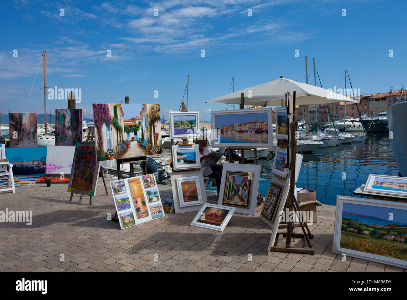 Paintings at strolling promenade at harbour of Saint-Tropez, french riviera, South France, Cote d'Azur, France, Europe Stock Photo