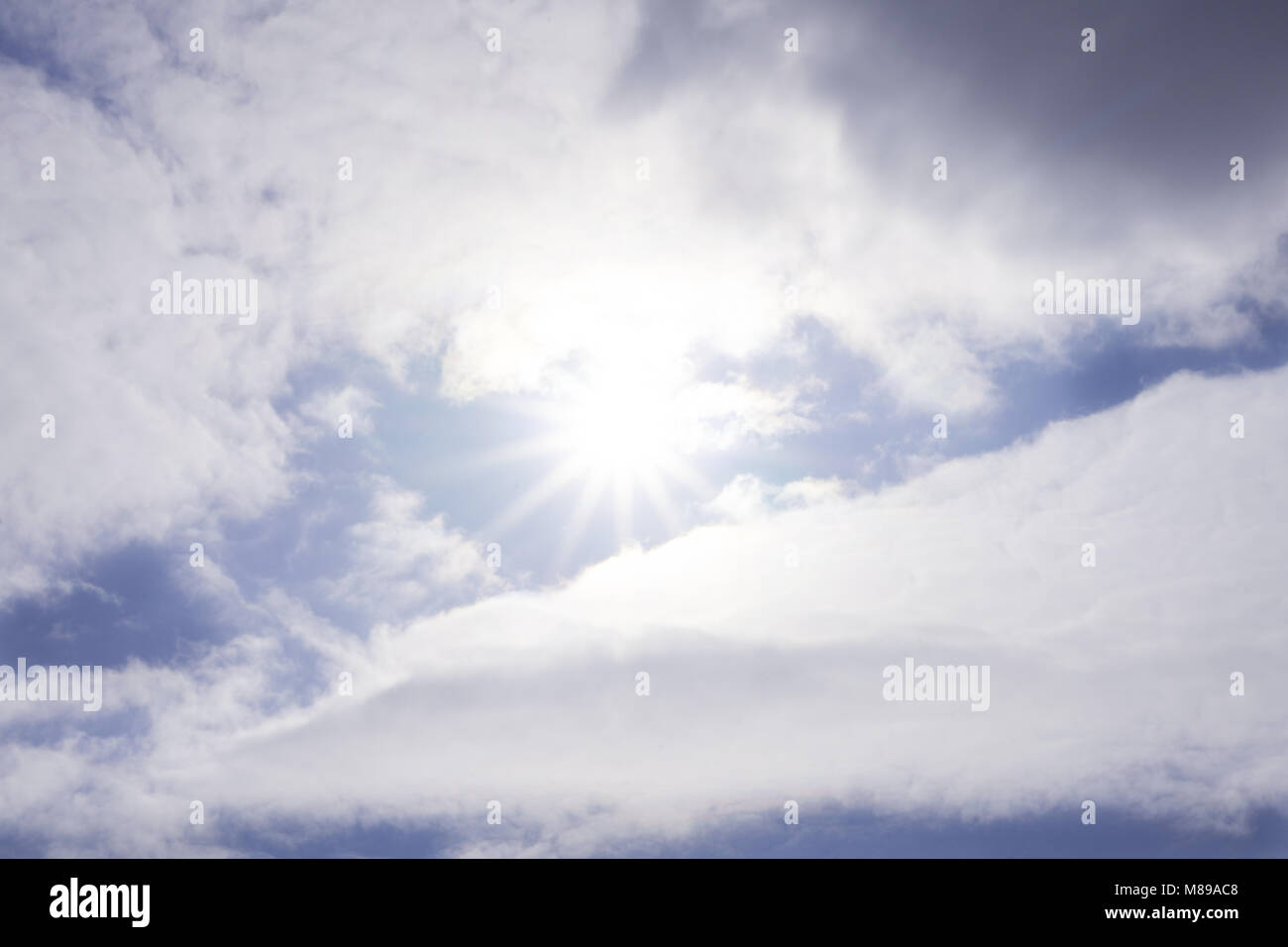 blue sky with sun and beautiful clouds Stock Photo - Alamy