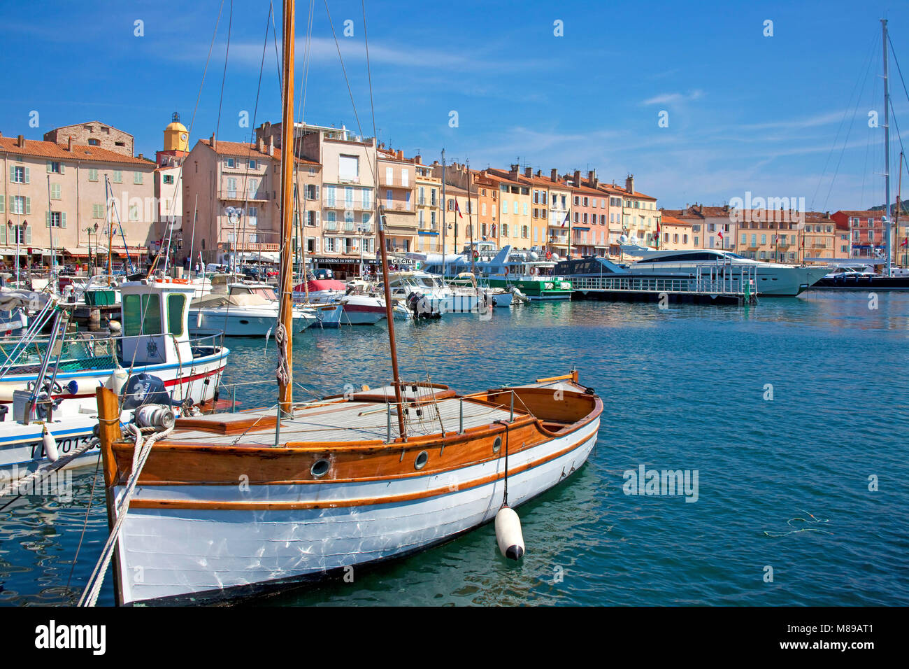 Sailing boat and fishing boats at harbour of SaintTropez, french