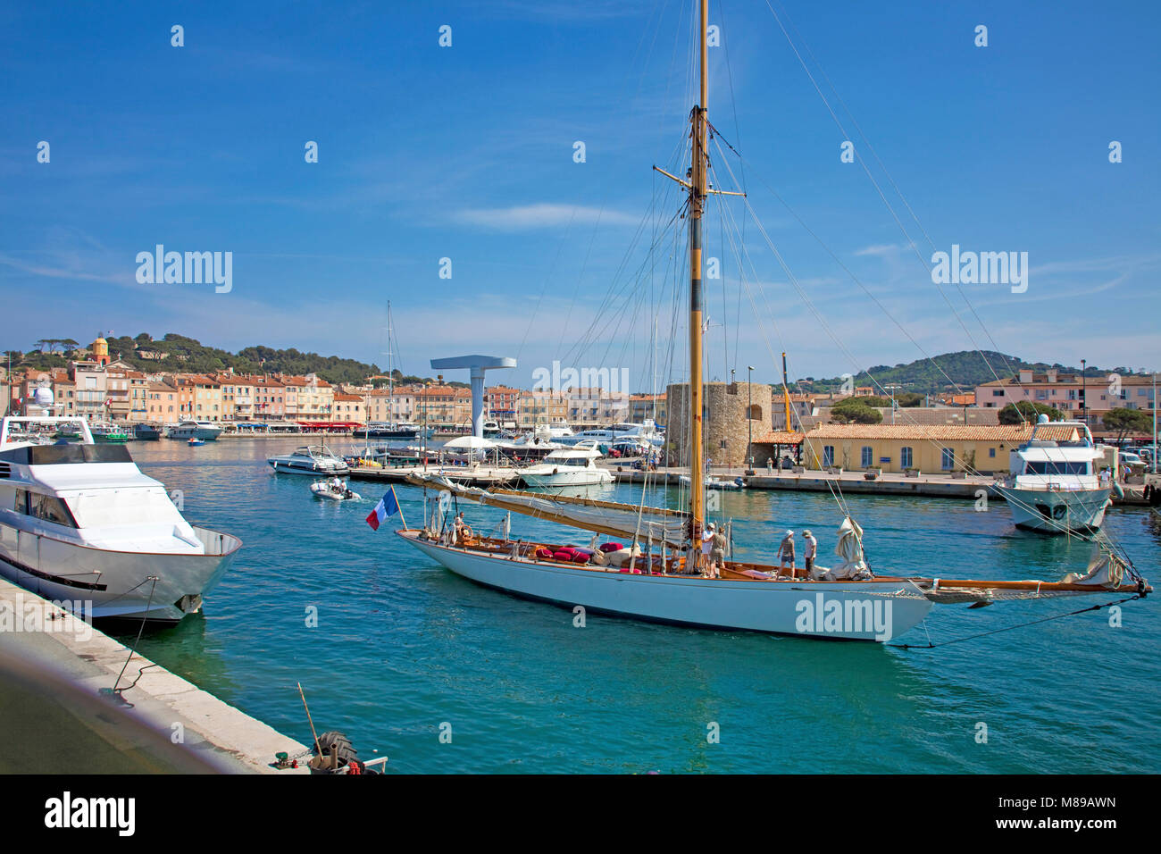 Sailing boat leaving the harbour of Saint-Tropez, french riviera, South France, Cote d'Azur, France, Europe Stock Photo