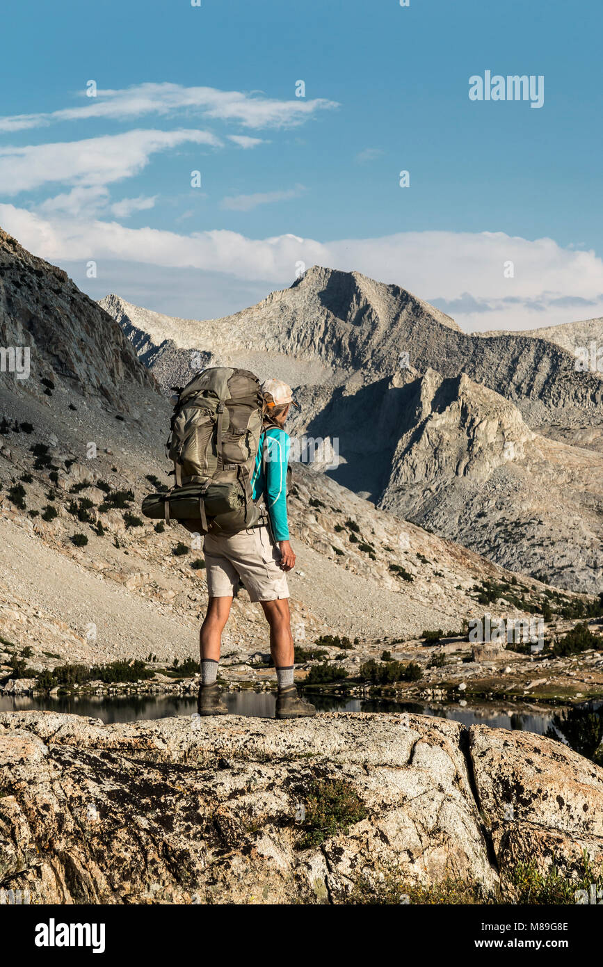 CA03395-00...CALIFORNIA - Vicky Spring hiking the John Muir Trail at Marjorie Lake in Kings Canyon National Park. (MR# S1) Stock Photo