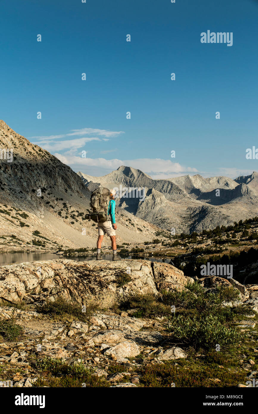 CA03396-00...CALIFORNIA - Vicky Spring hiking the John Muir Trail at Marjorie Lake in Kings Canyon National Park. (MR# S1) Stock Photo