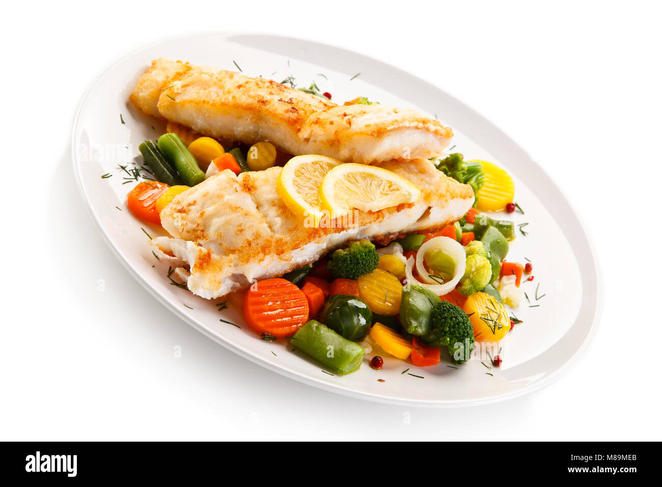 Fish dish - fried fish fillet and vegetables Stock Photo