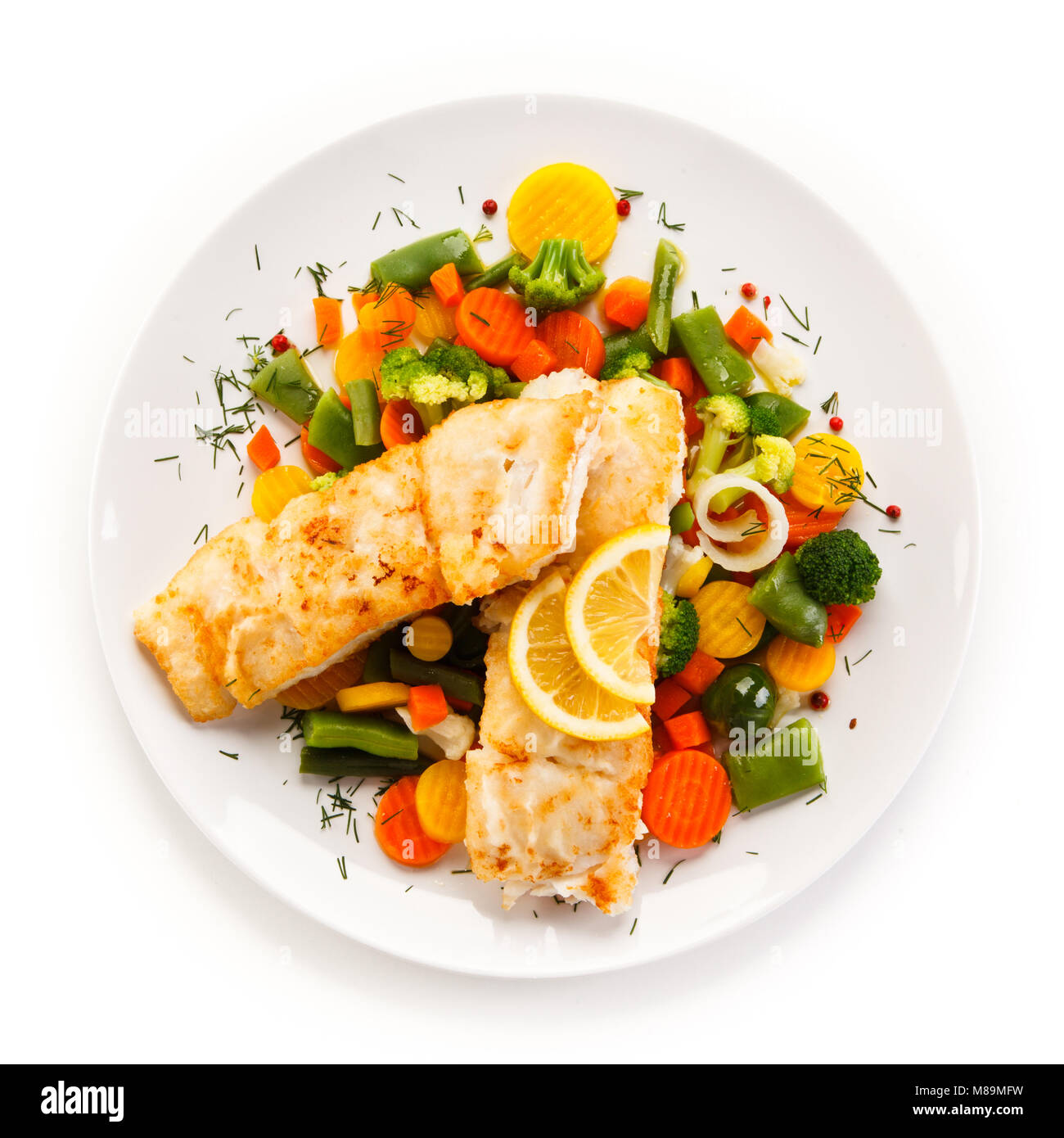 Fish dish - fried fish fillet and vegetables Stock Photo - Alamy