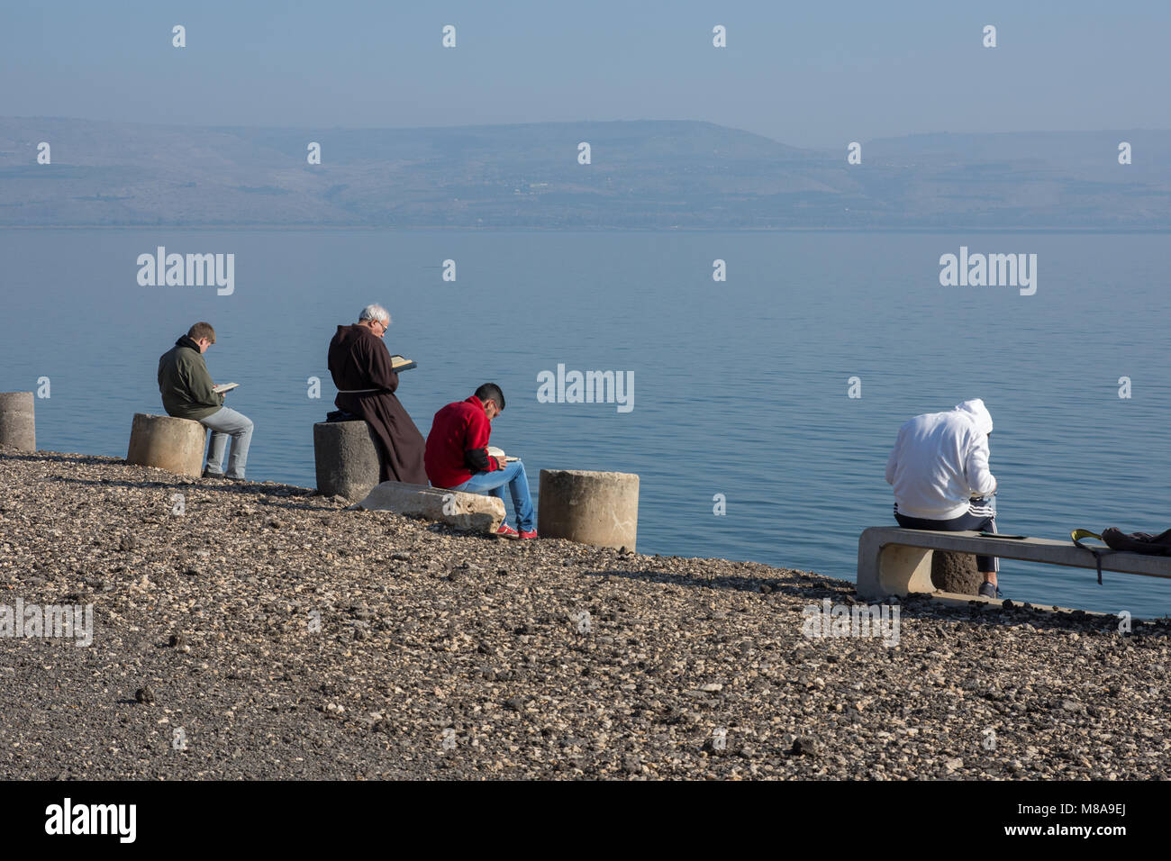 Praying at the Sea of Galilee at the Fransican Monastery at Capernaum, Israel Stock Photo