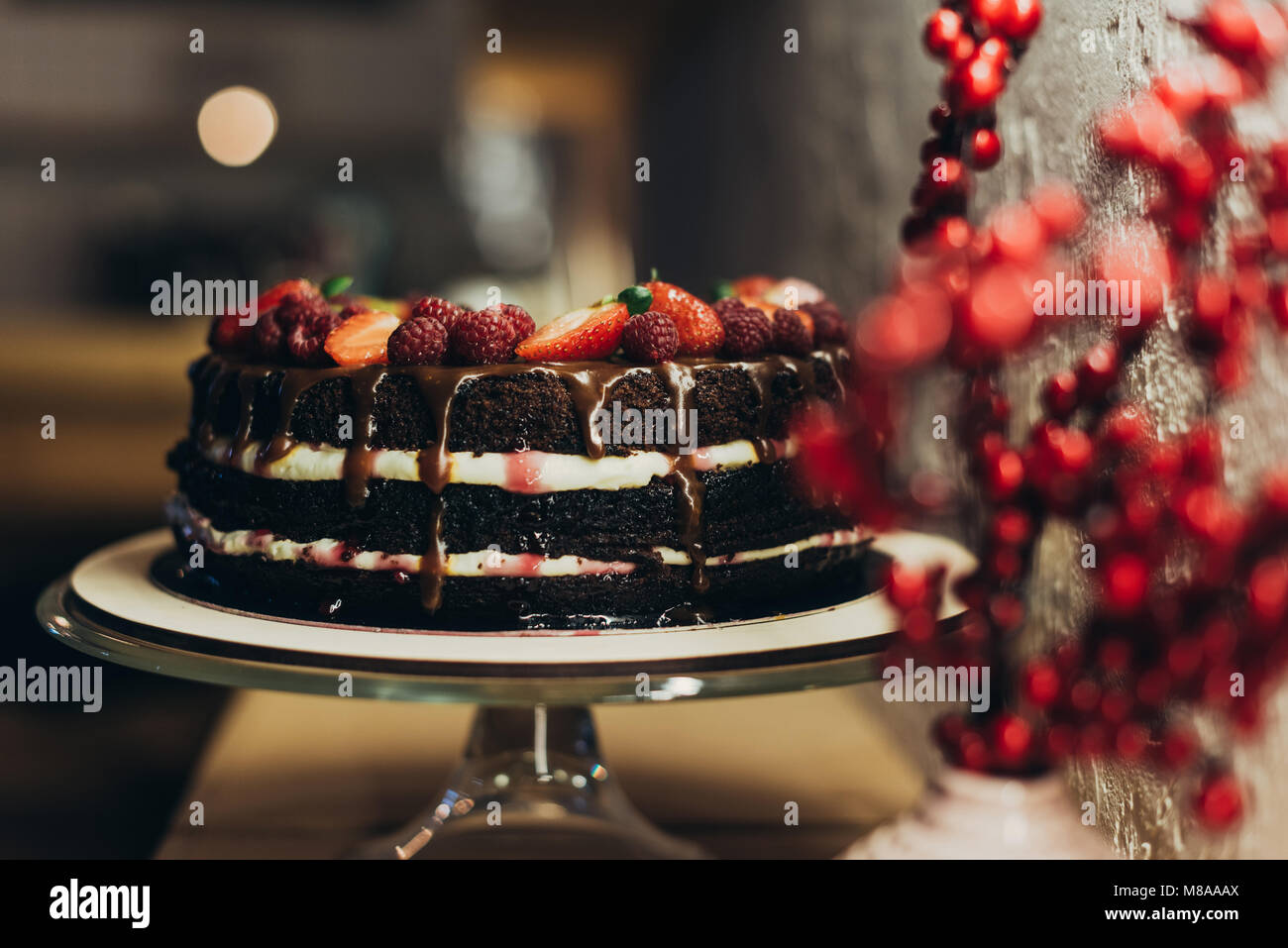 Chocolate cake on cake stand Stock Photo