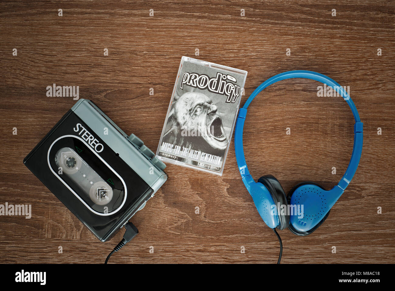 Vintage walkman, the prodigy cassete and headphones. Stock Photo