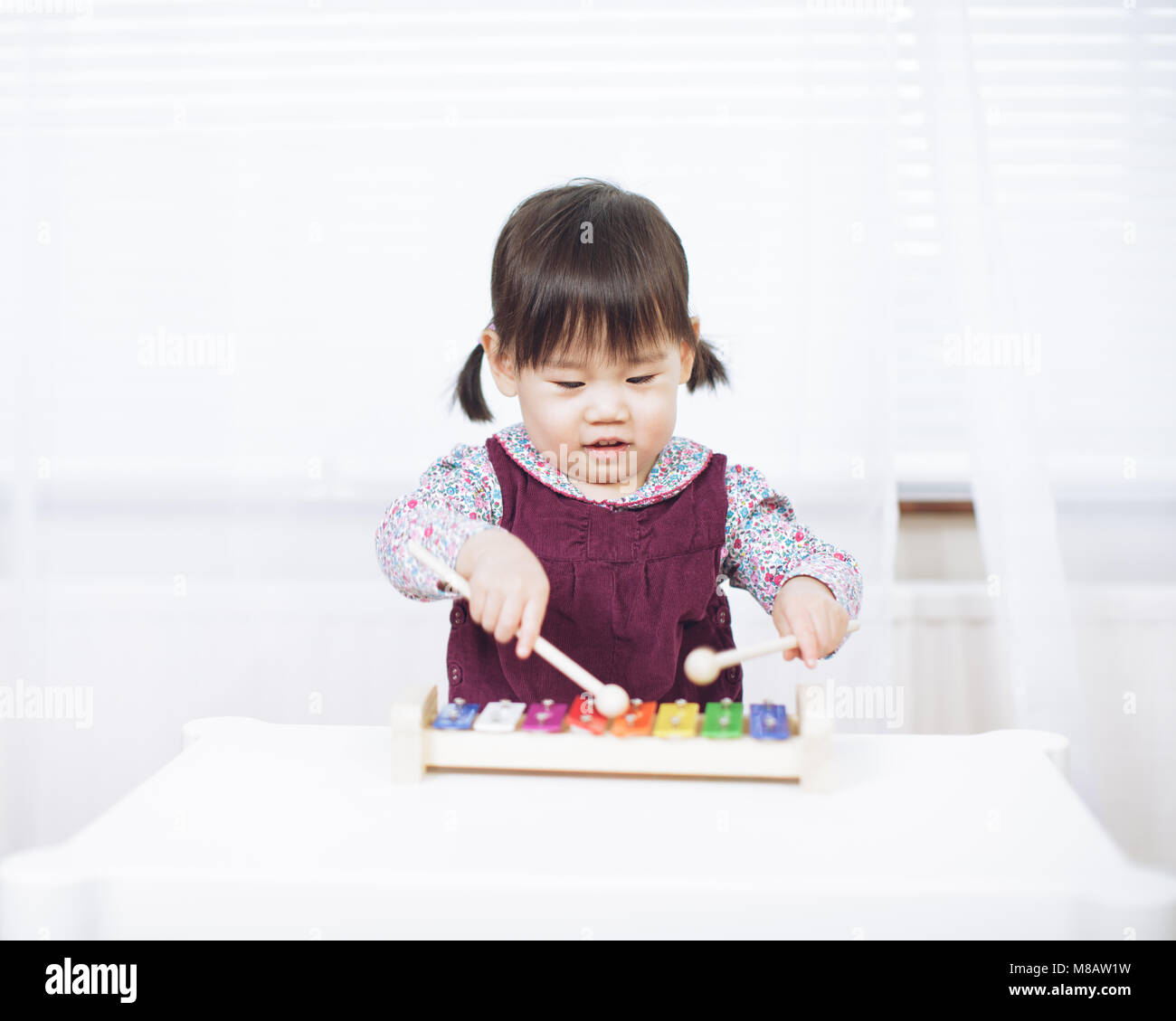 baby girl play xylophone at home Stock Photo Alamy