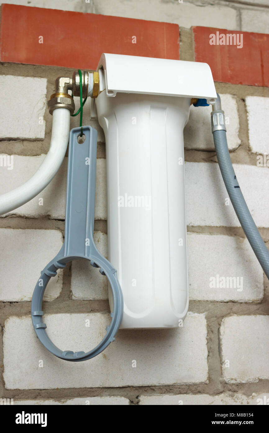 Water filter is mounted on a brick wall Stock Photo - Alamy
