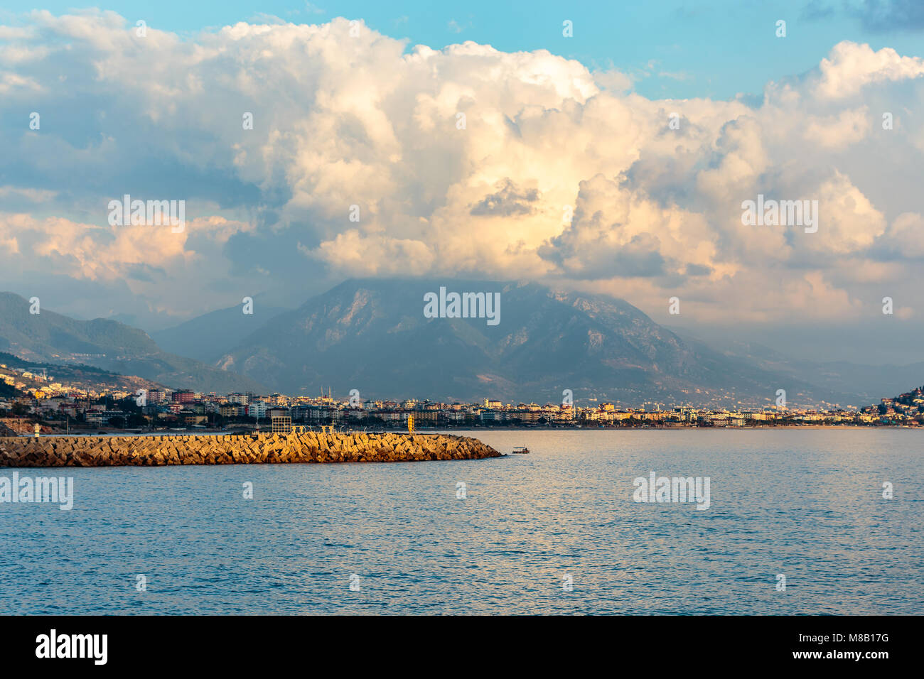 Far. Distance View Seascape with mediterranean coastal town with mountains at far distance ...