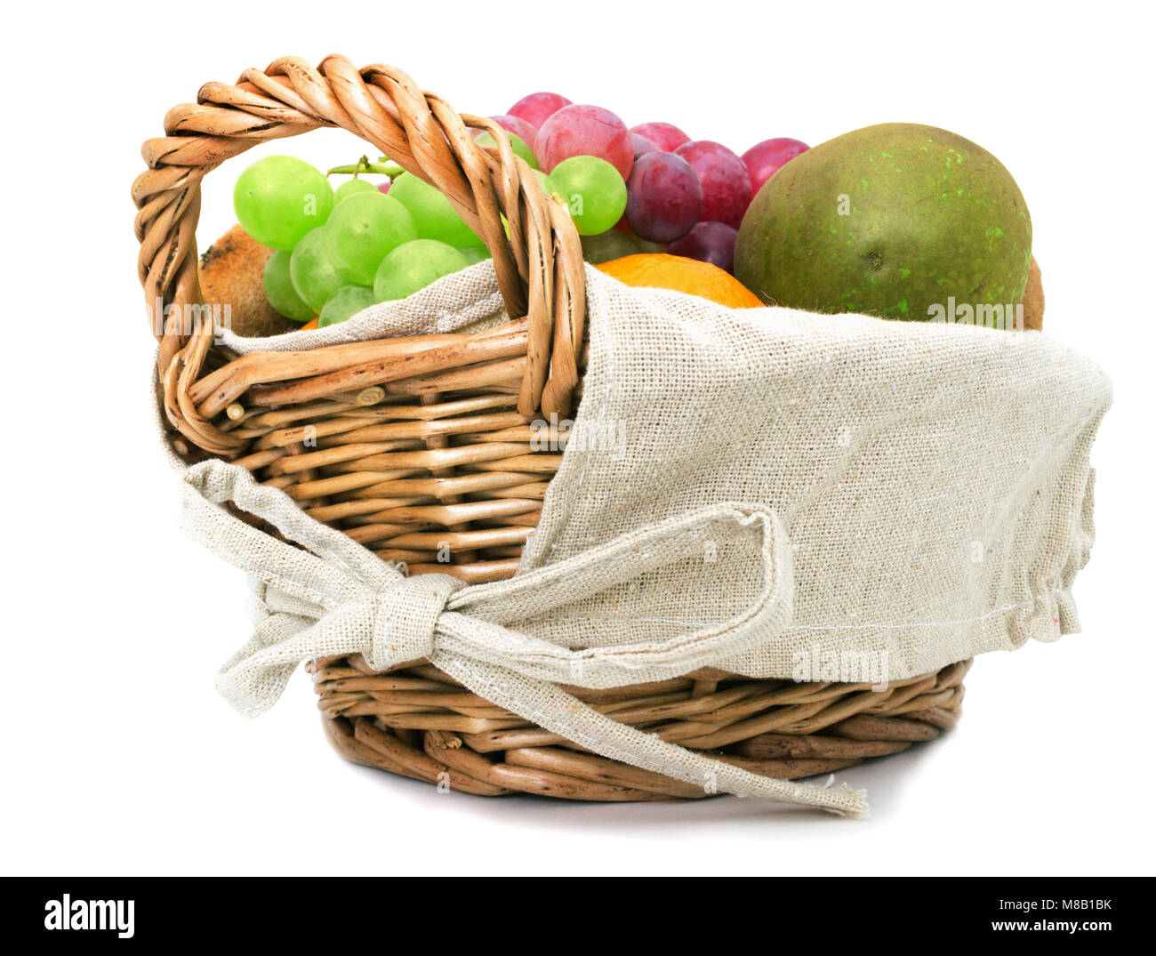 Grapes, pears and other fruits in the basket on a white background Stock Photo