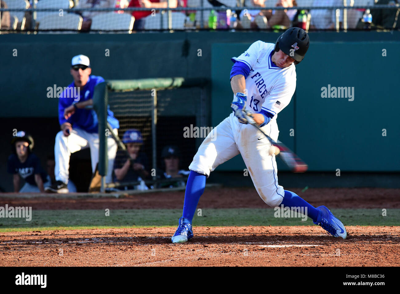 Air Force Academy center fielder Daniel Jones hits a baseball during
