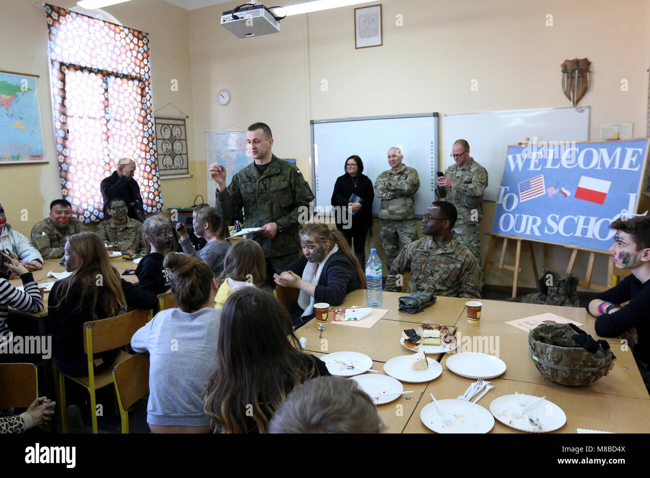 Maj. Krzystof Karnicki, civil military cooperation officer, Polish 11th Armored Cavalry Division, talks about the next activity planned for students and US Soldiers at Zagan Public School 2, in Zagan, Poland, Feb. 27, 2018. The Soldiers were invited to the school to introduce the students to the US military and to build understanding and appreciation of each others' culture. (US Army Stock Photo