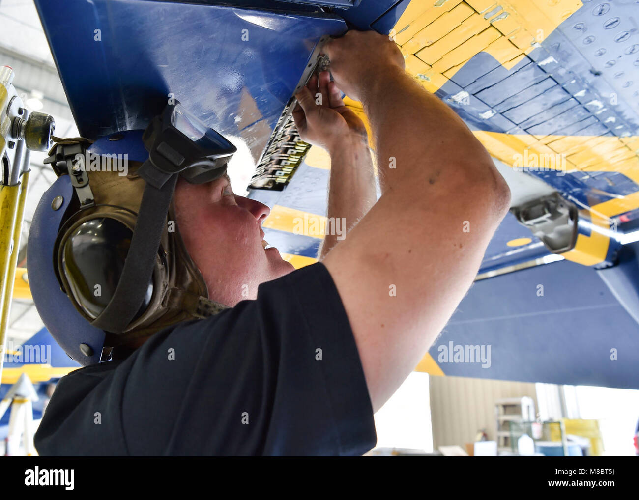 EL CENTRO, Calif. (Feb. 22, 2018) Aviation Structual Mechanic 1st Class, Joe Hopkins, performs mainenance on a leading edge flap. The Blue Angels are scheduled to perform more than 60 demonstrations at more than 30 locations across the U.S. in 2018. (U.S. Navy Stock Photo