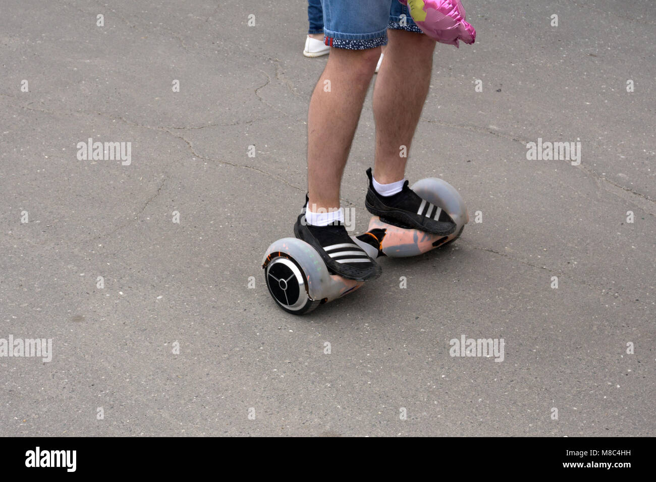 l riding on hover board or gyroscooter outdoors at sunset in summer. Active  life concept Stock Photo - Alamy