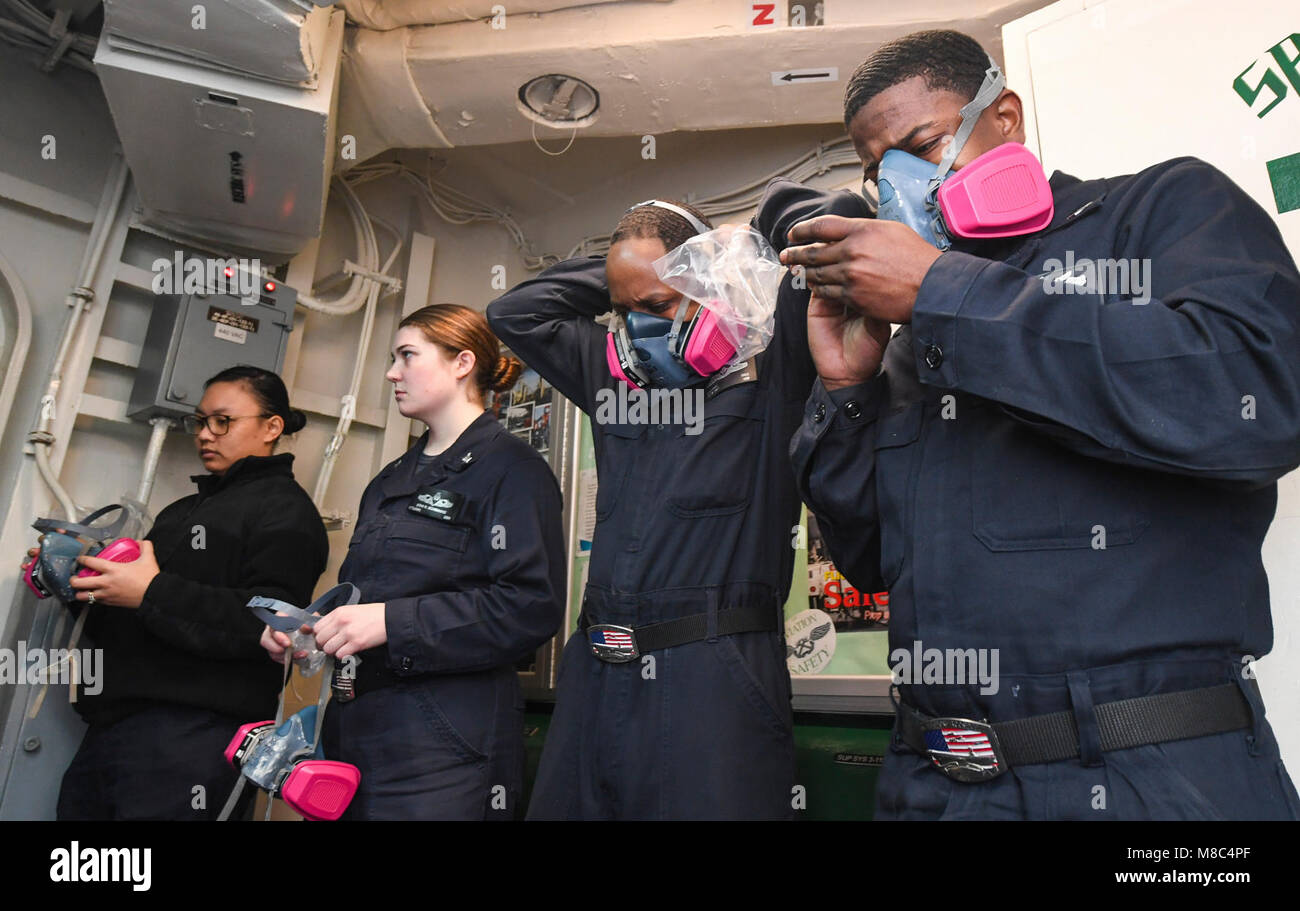 Navy Inhaler ARABIAN GULF (Feb. 26, 2018) Sailors don respirators during a ...