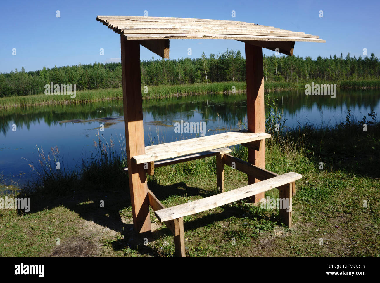 A wood gazebo over looks the River in on a blue sky day Stock Photo - Alamy