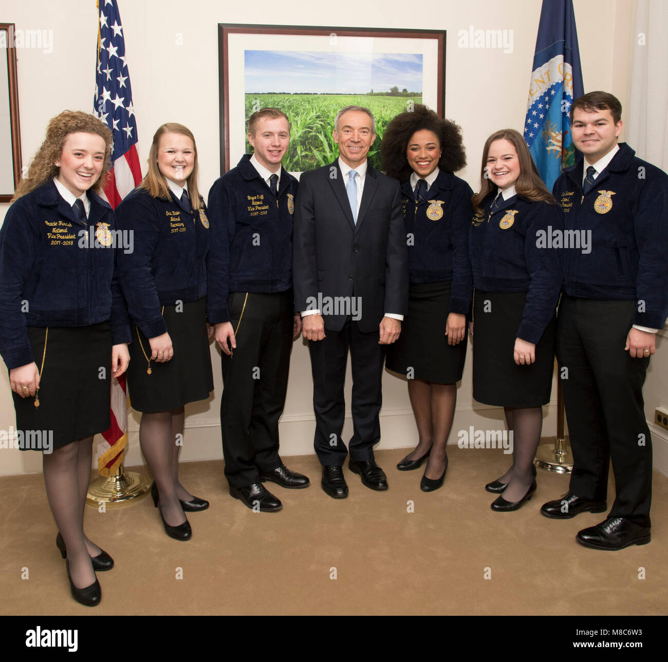 U.S. Department of Agriculture ) Deputy Secretary Steve Censky, center, meets with the current FFA National Officer Team of Vice President Gracie Furnish, Secretary Erica Baier, Vice President Bryce Cluff, President Breanna Holbert, Vice Presidents Piper Merritt and Ian Bennett before attending National African American History Month observance event at the USDA headquarters in Washington, D.C., on Feb. 15, 2018. The event honors the significant contributions African Americans over the course U.S. history. The event is recorded for distribution to employees around the world. Stock Photo