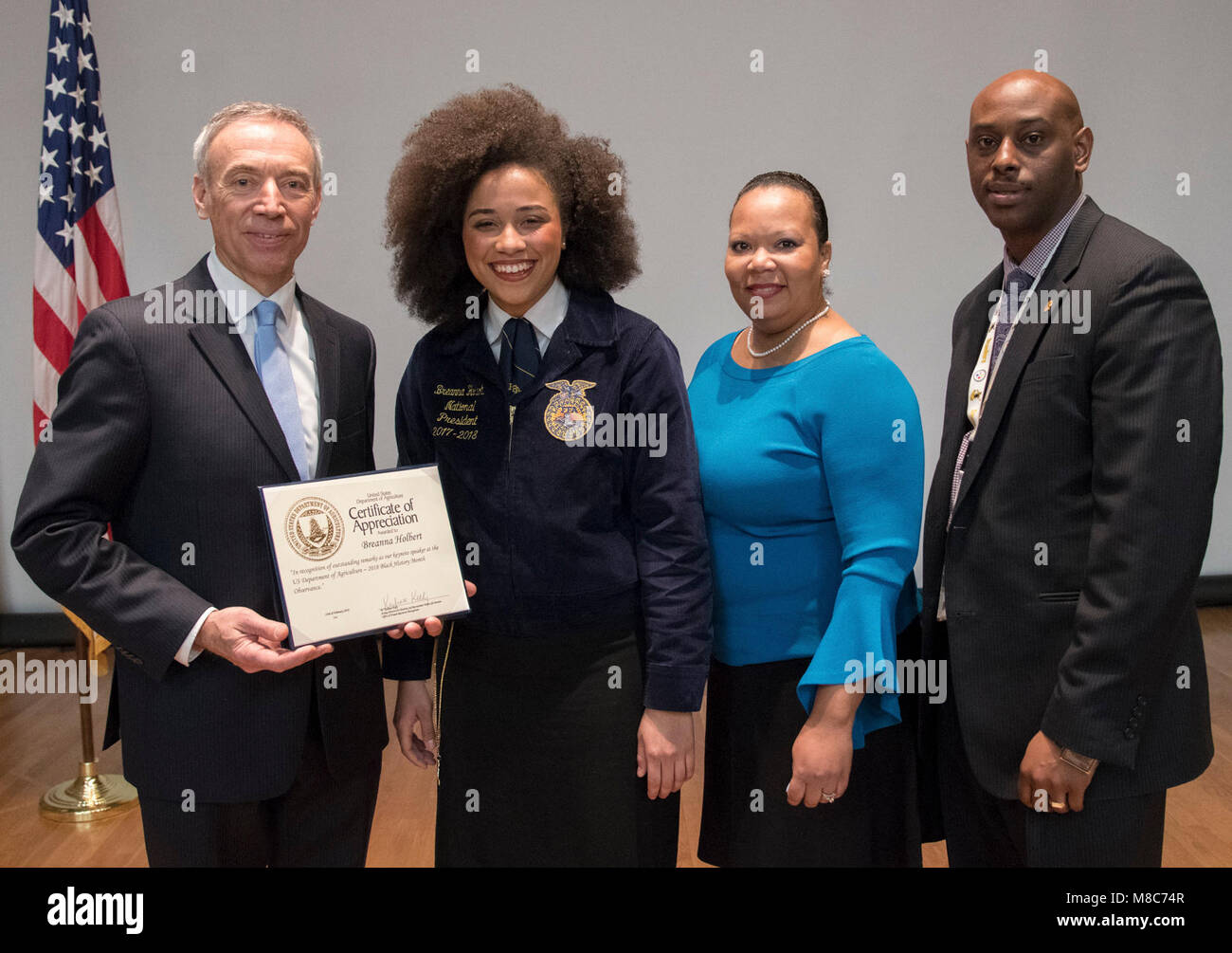 From left, U.S. Department of Agriculture ) Deputy Secretary Steve Censky, presents a
