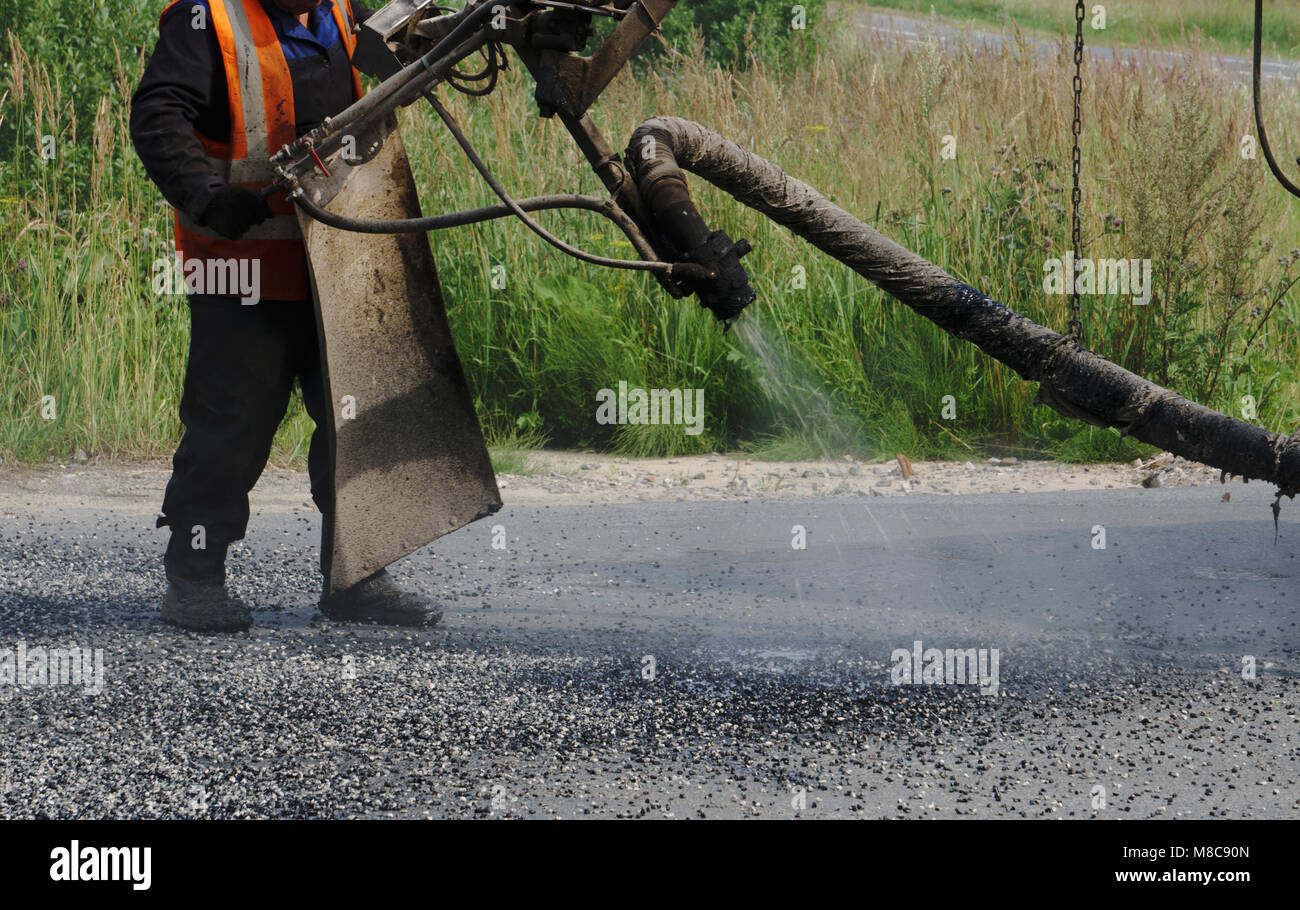 Asphalting machines hi-res stock photography and images - Alamy