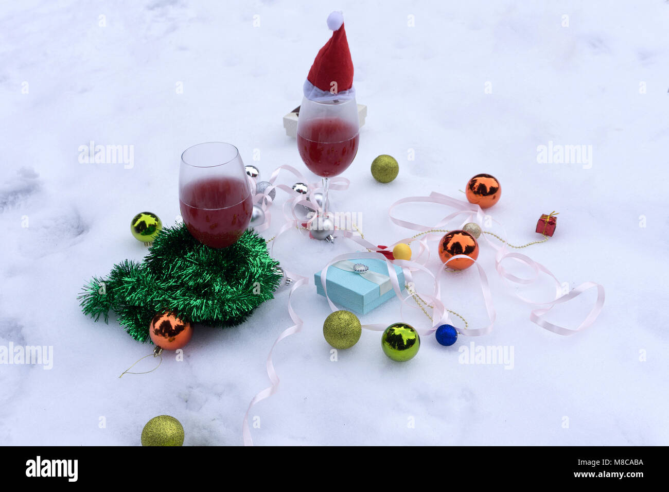 glasses of wine glasses of wine on the background of Christmas decorations. Christmas decorations with wineglass Stock Photo