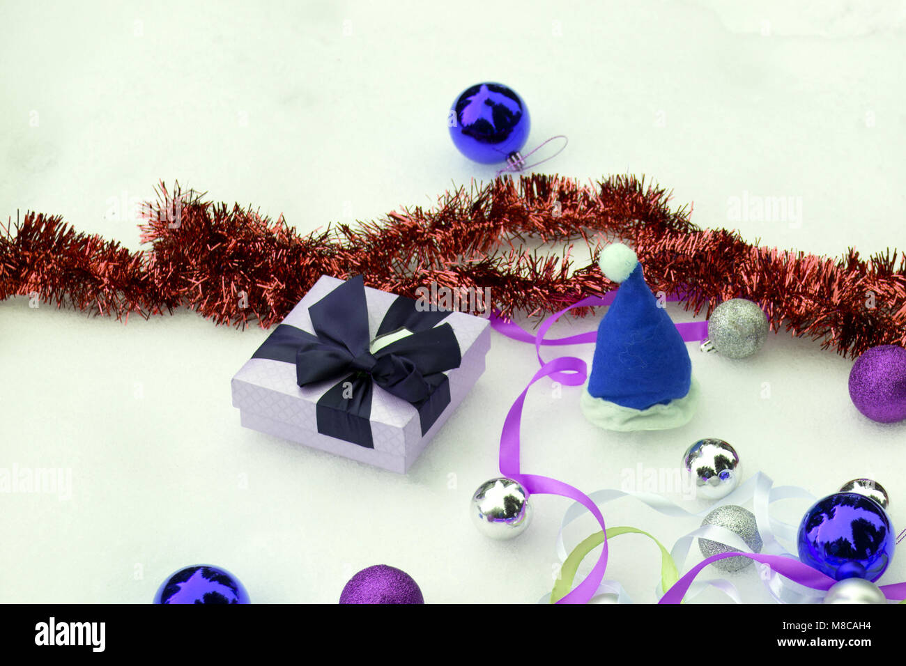 Christmas colorful balls and fir branch on white snow background Stock ...