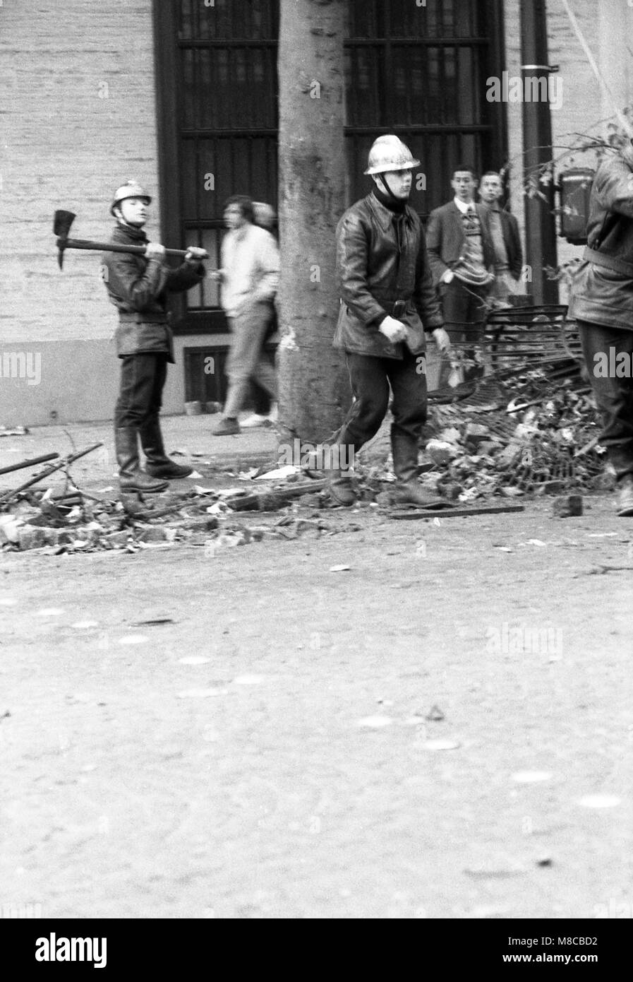 Philippe Gras / Le Pictorium -  May 68 -  1968  -  France / Ile-de-France (region) / Paris  -  Firefighters clear the remains of the barricades that strew the streets of Paris Stock Photo
