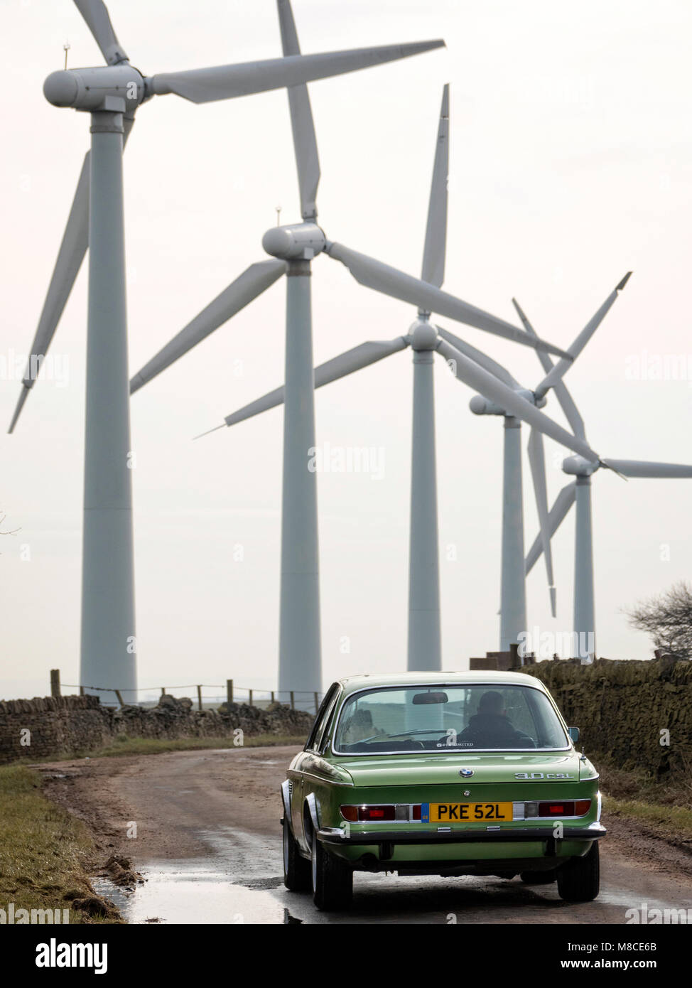 BMW CSI by a  Wind Turbine Farm Whitley Rd South Yorkshire UK Stock Photo