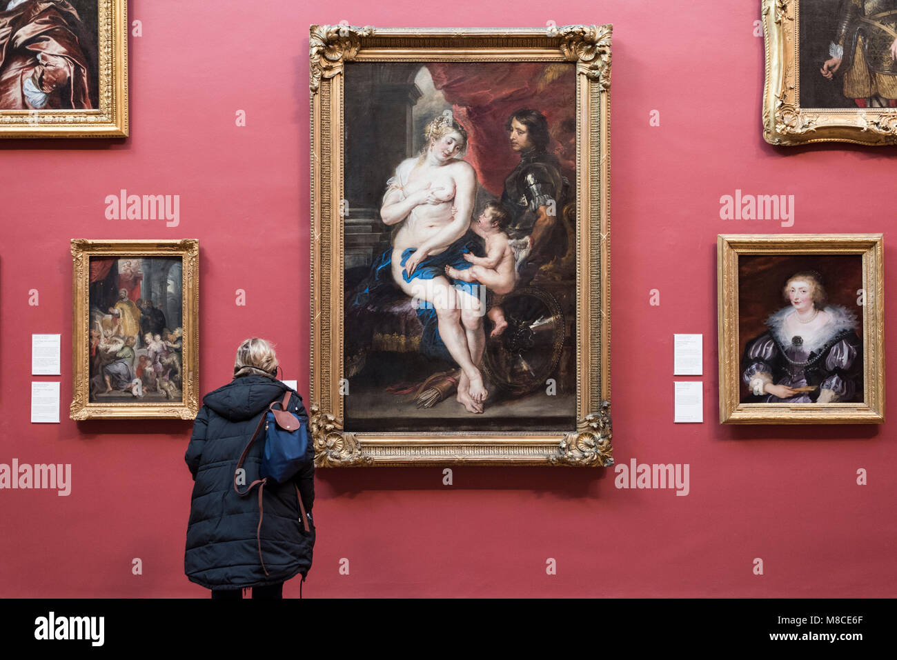 London. England. UK. Dulwich Picture Gallery, visitor looking at Peter Paul Rubens' 'Venus, Mars and Cupid' ca. 1635. Stock Photo
