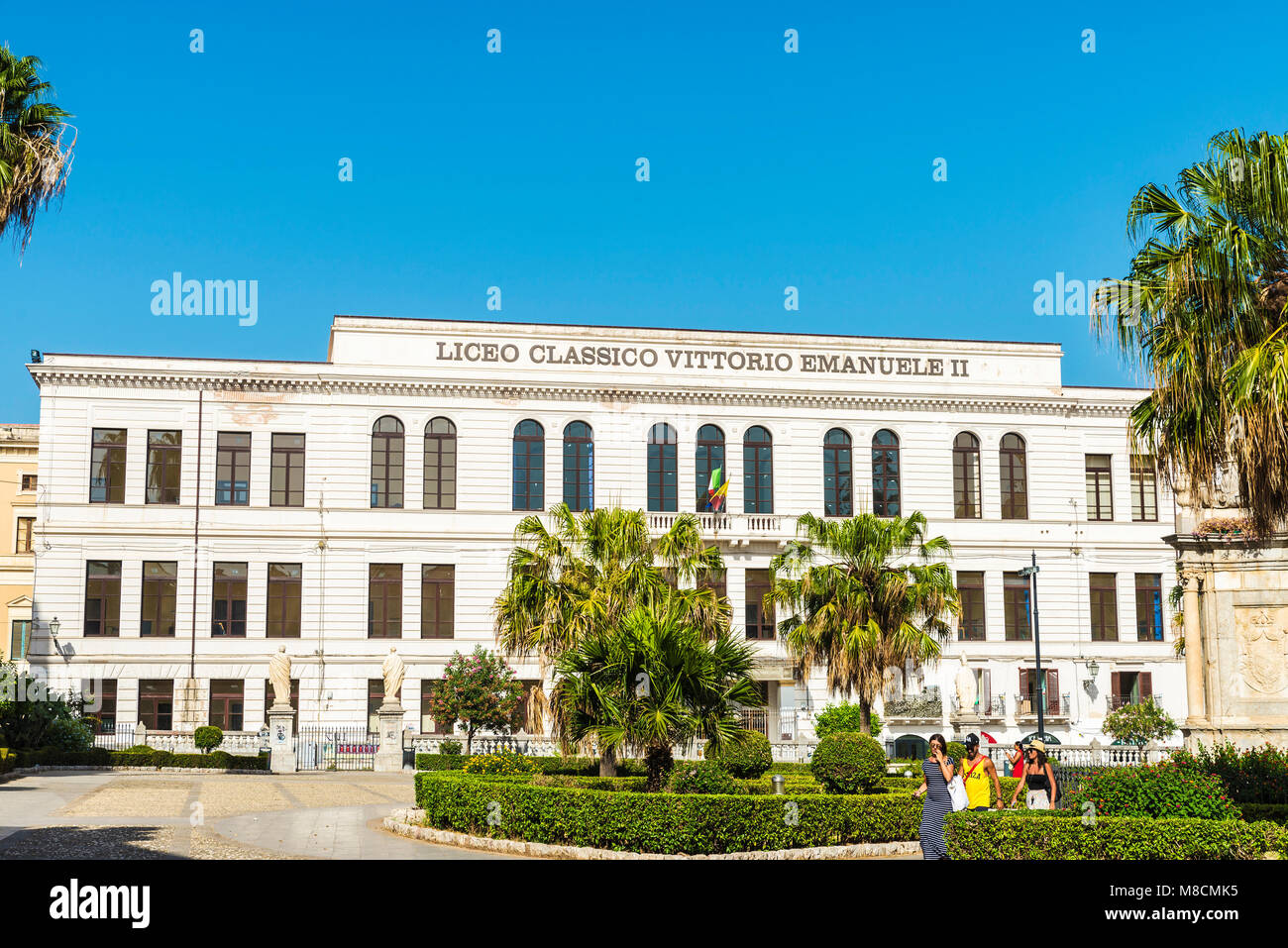 Palermo, Italy - August 10, 2017: Facade of the Liceo Classico Vittorio Emanuele II with people around in the center of Palermo in Sicily, Italy Stock Photo
