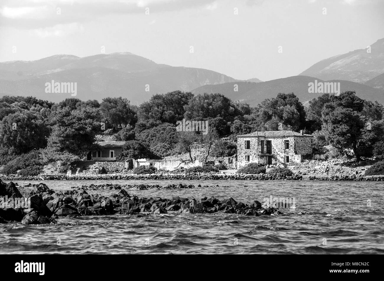 Old abandoned stone house on a greek very small island named Lichadonisia, located in Sterea Elada, Greece Stock Photo