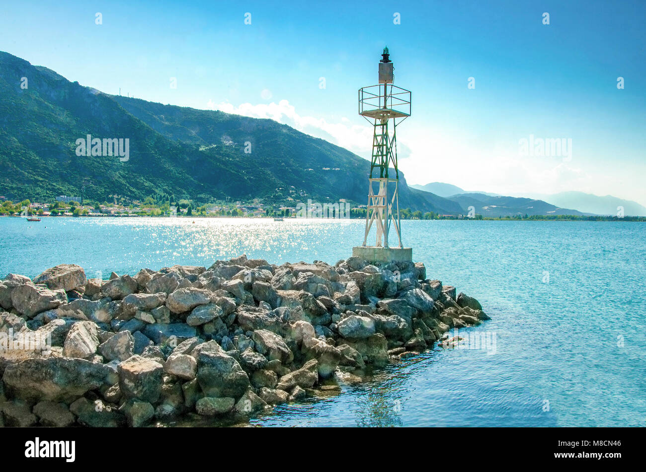 Lighthouse on rocks. Kamena Vourla, Greece Stock Photo