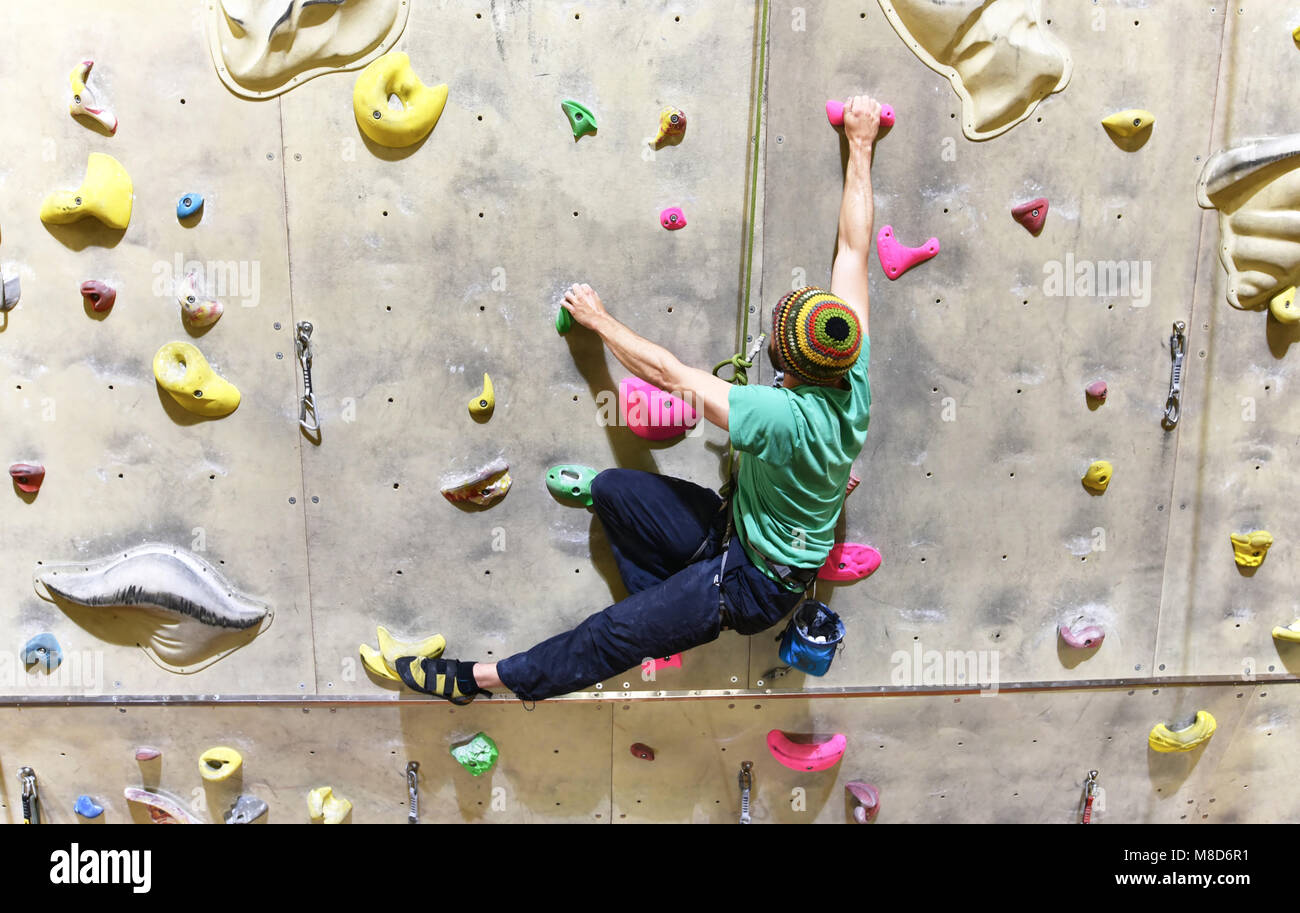 Man climbing indoor wall hi-res stock photography and images - Alamy