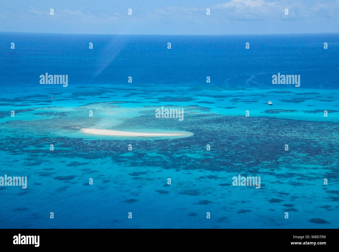 Great Barrier Reef with anchored yacht near Carins, Queensland, Australia - view from helicopter Stock Photo