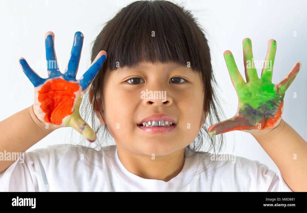 little girl with hands in paint on white Stock Photo