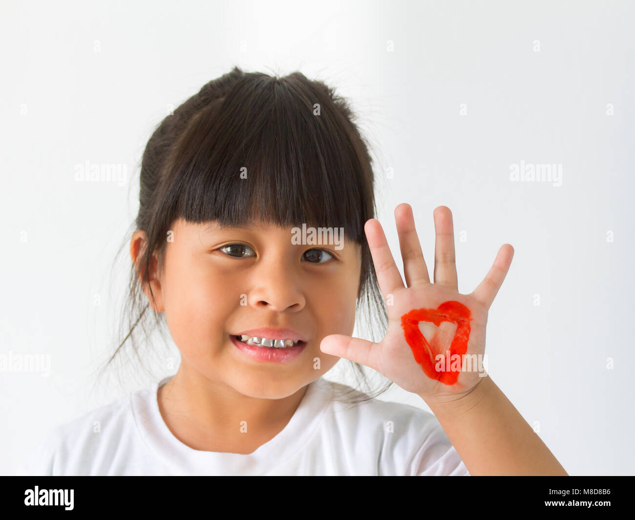 Girl Writing For A Heart Shape Stock Photo Alamy