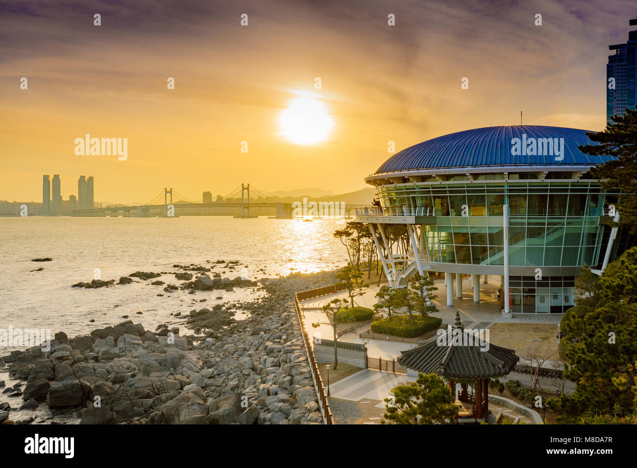 Busan Gwangan Bridge and Nurimaru APEC House at sunset Stock Photo