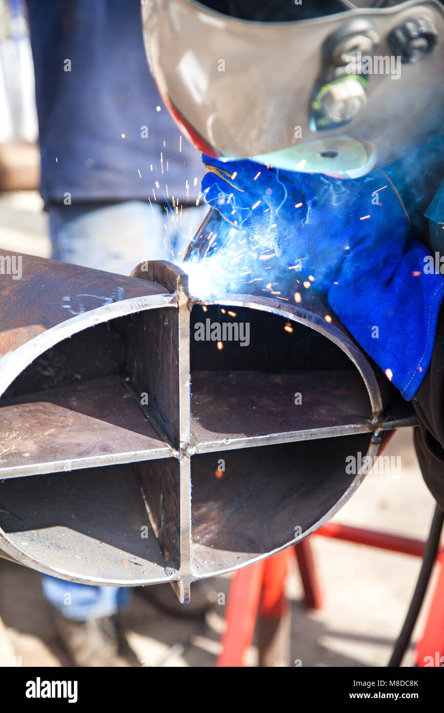 Welding work, welder welding metal material in heavy industry manufacturing, video clip Stock Photo