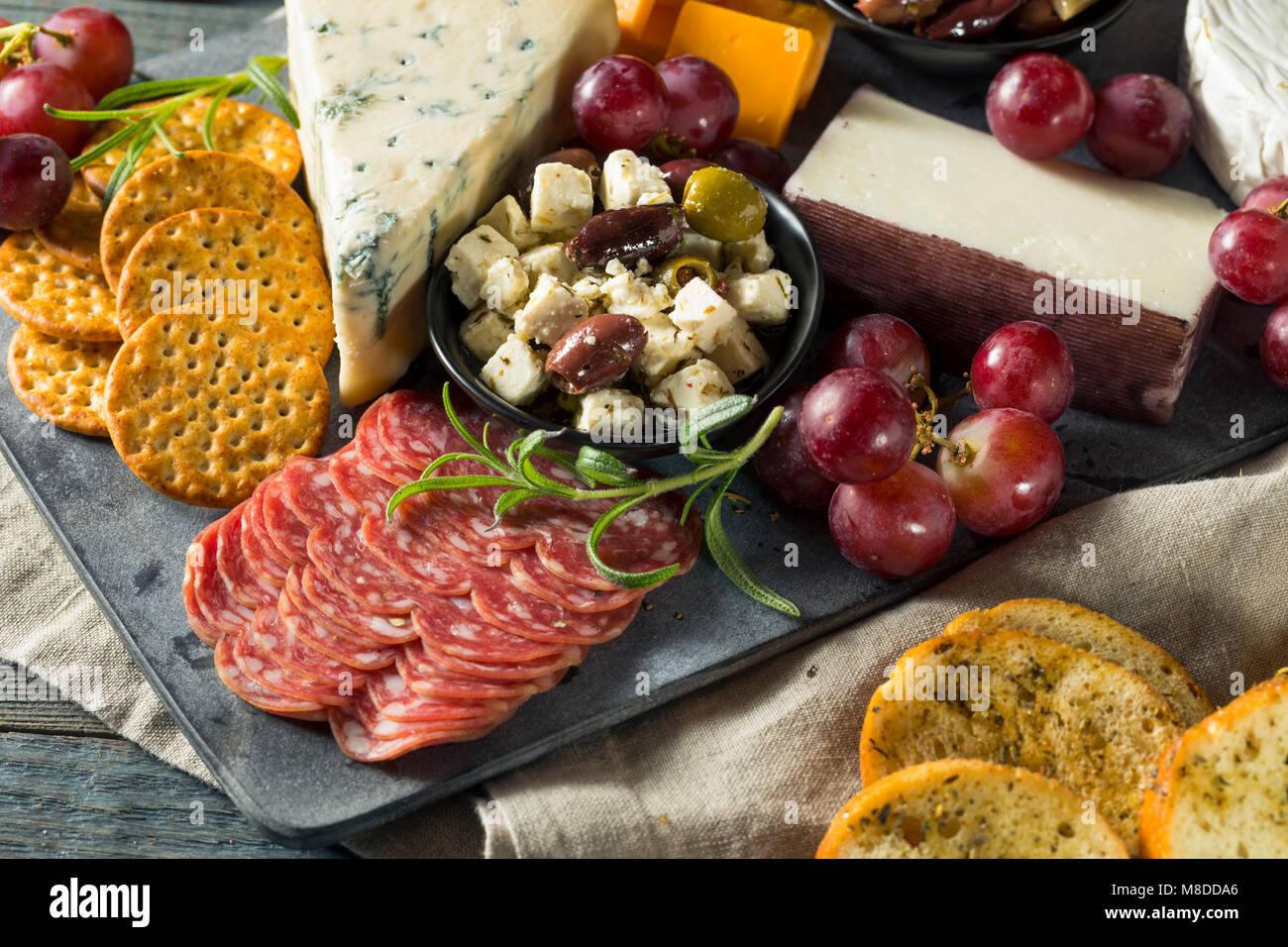 Gourmet Fancy Charcuterie Board with Meat Cheese and Grapes Stock Photo