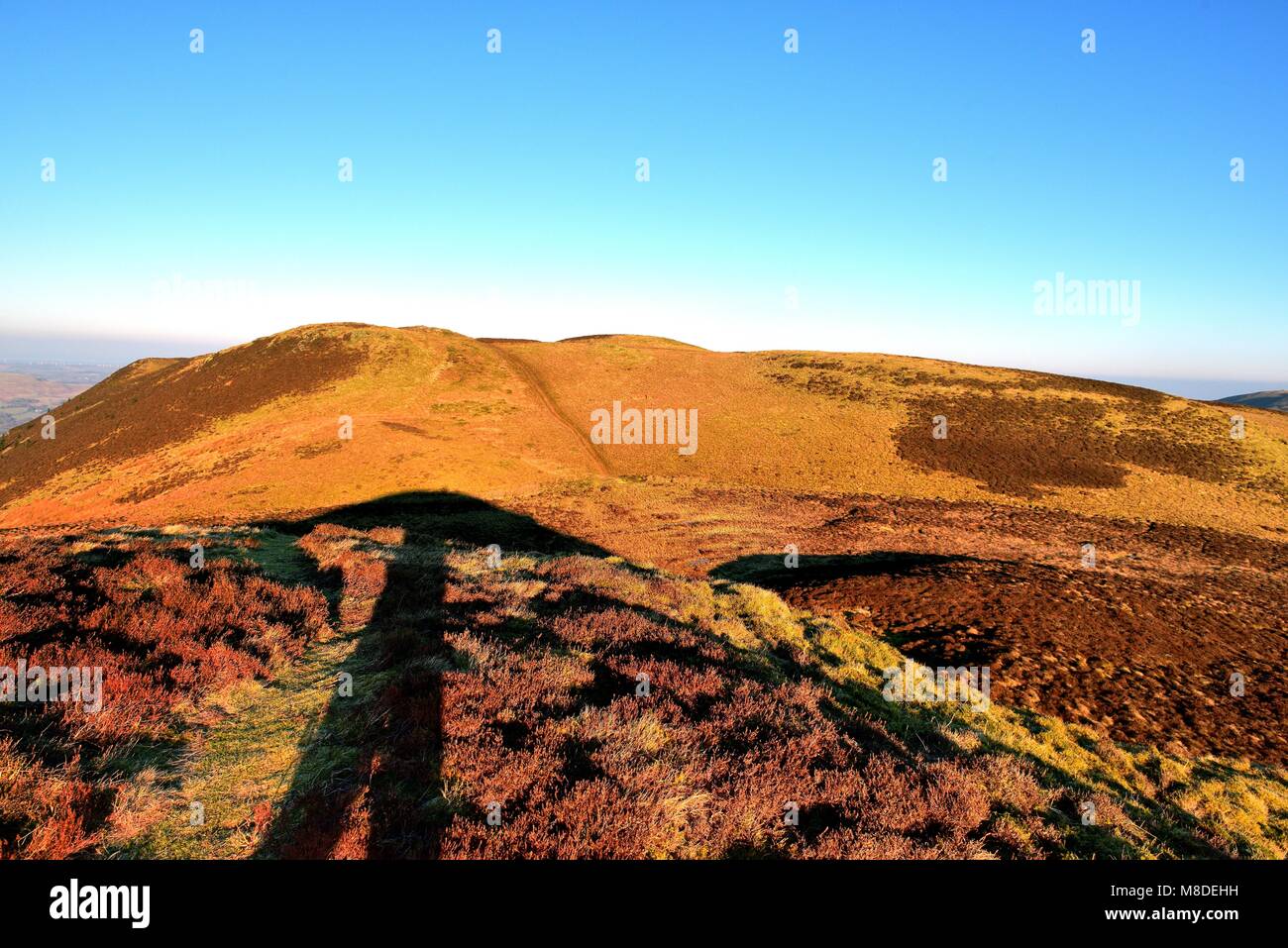 Shadows on the track on Whinlatter Stock Photo