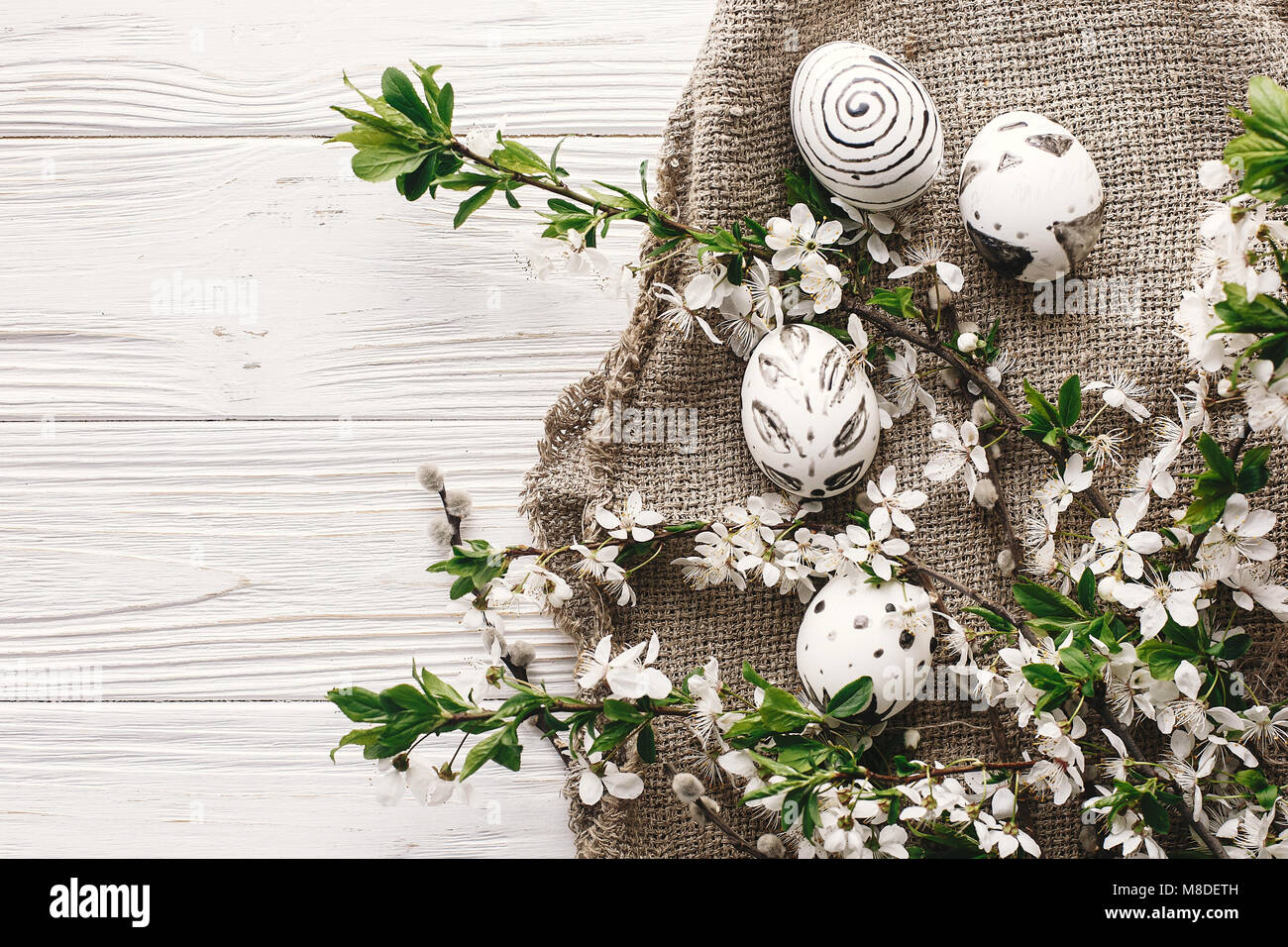 stylish easter flat lay with painted eggs black and white colors at ...