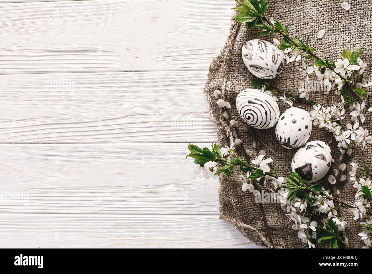 stylish easter flat lay with painted eggs black and white colors at ...