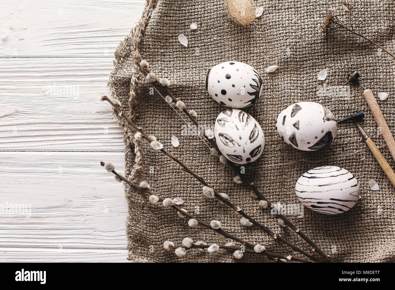 stylish easter flat lay with painted eggs black and white colors at ...