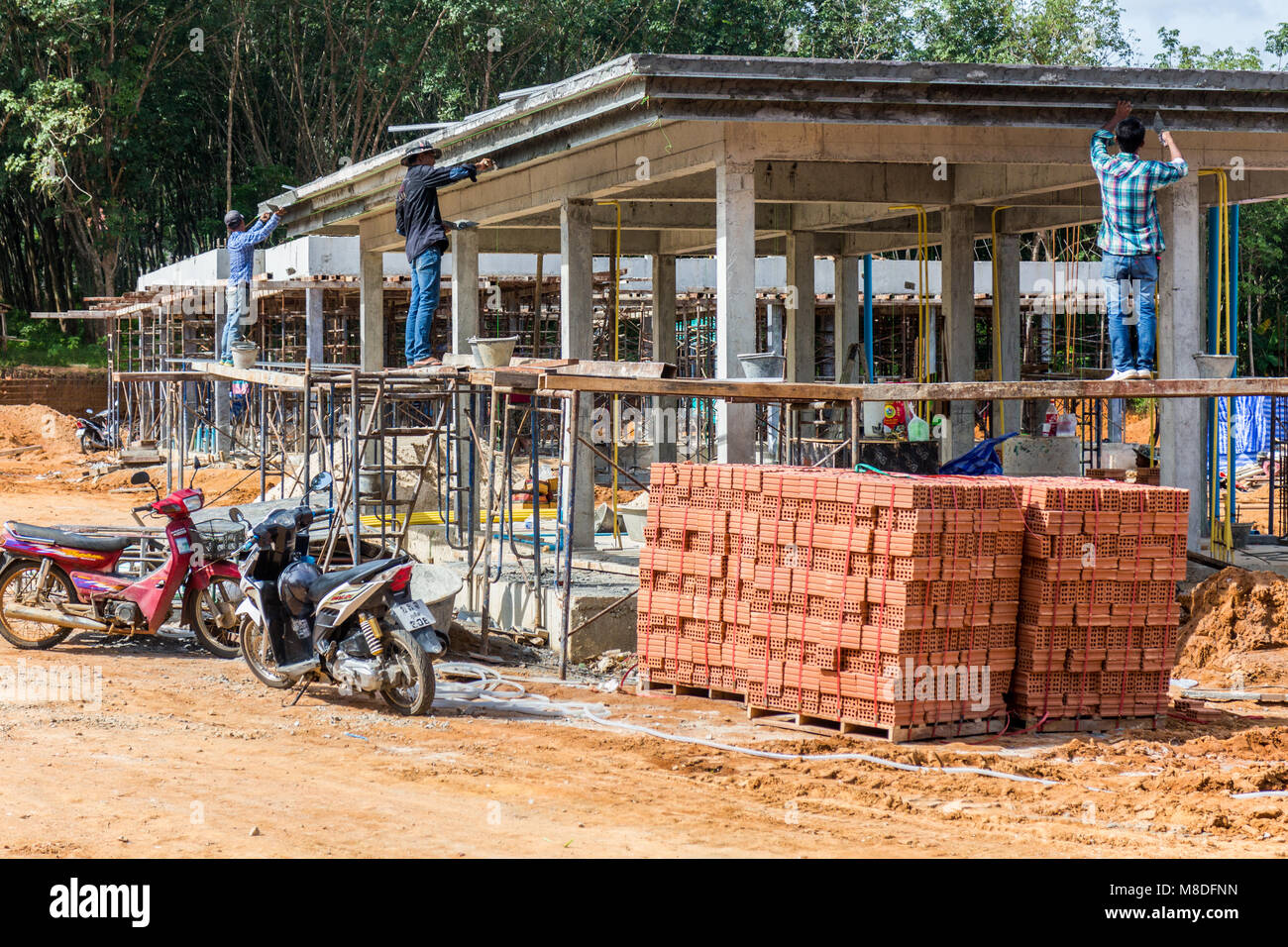 Burmese construction workers on building site, Phuket, Thailand Stock