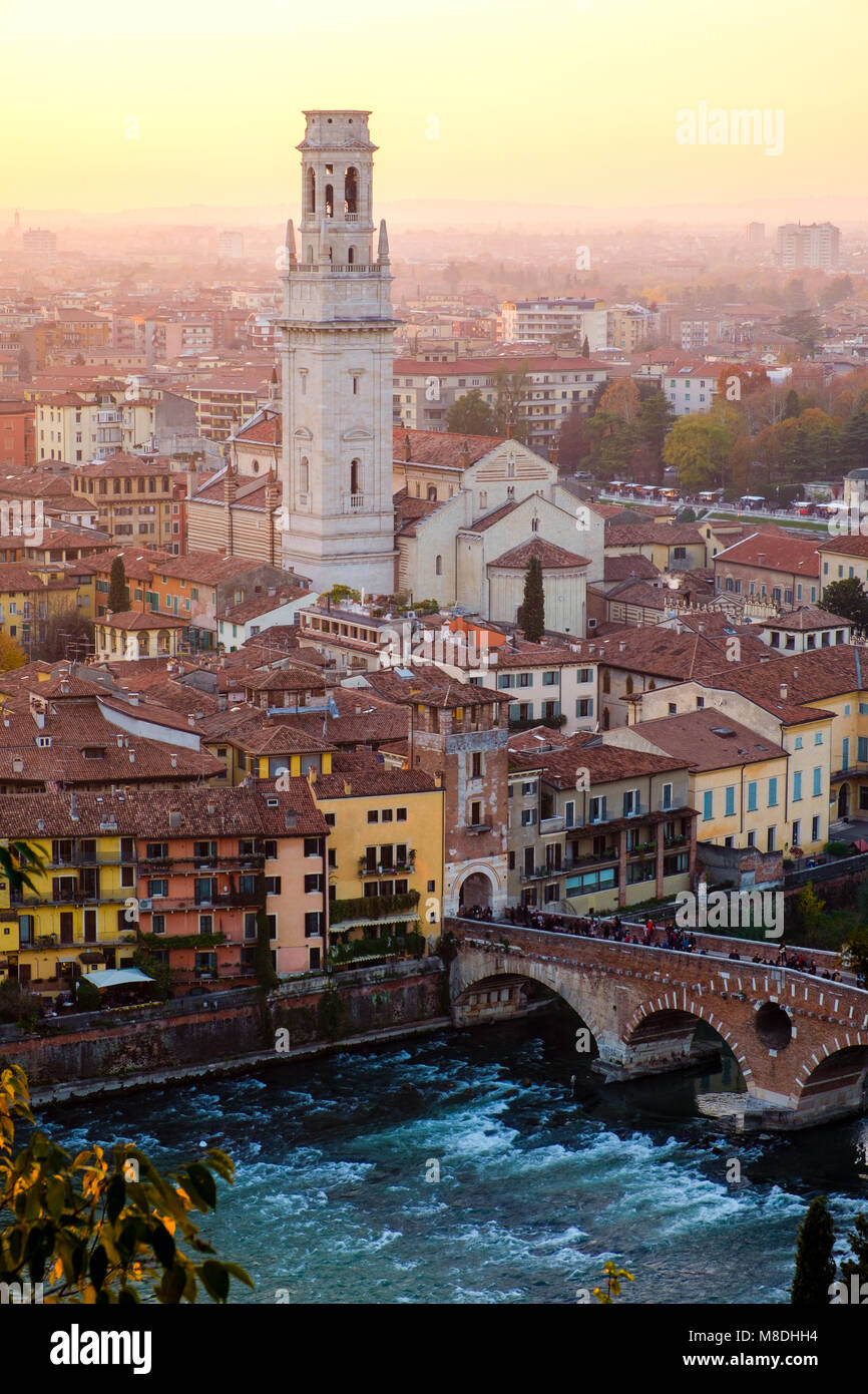 View of Verona city with Ponte Pietra and the river Adige at sunset.Italy. Stock Photo
