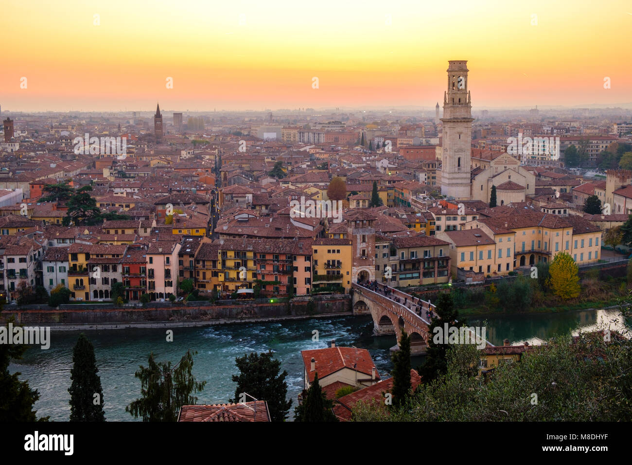 View of Verona city with Ponte Pietra and the river Adige at sunset ...