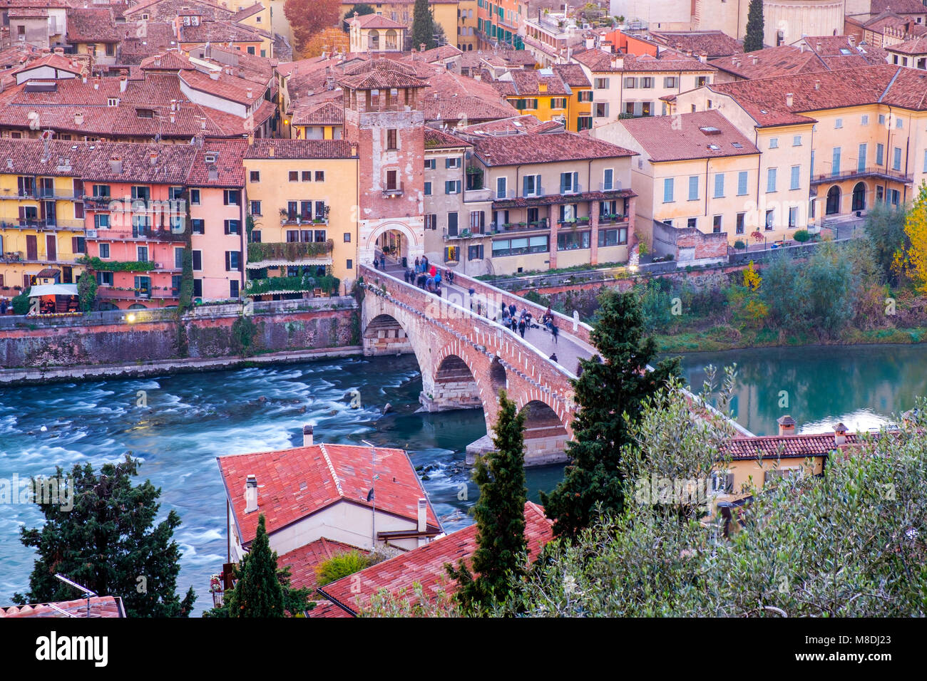 Ponte Pietra bridge on Adige river sunny day in Verona, Italy Stock ...